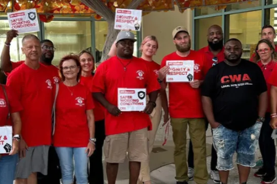 CWA Local 3179 members and allies pose for pictures